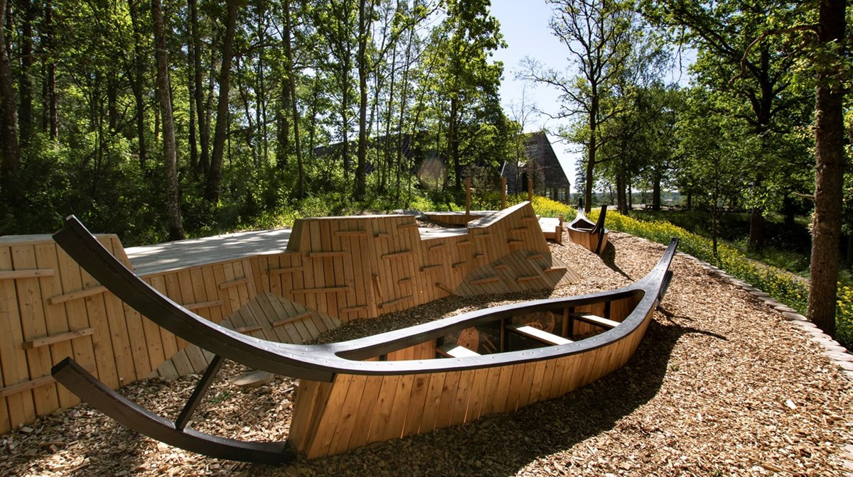 playground with boats in wood.
