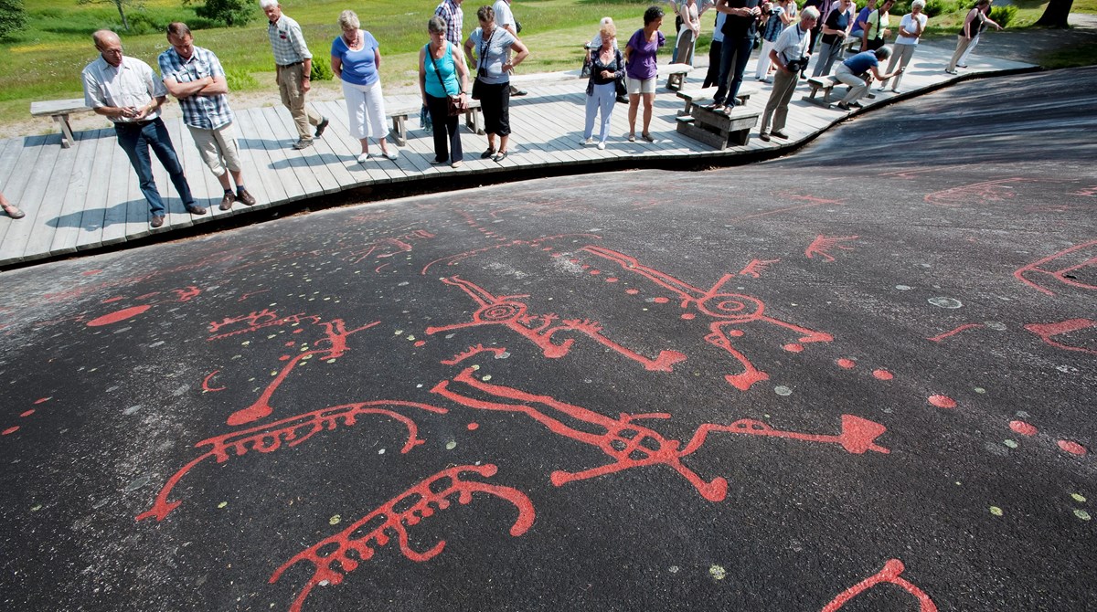 Rock carvings painted red.