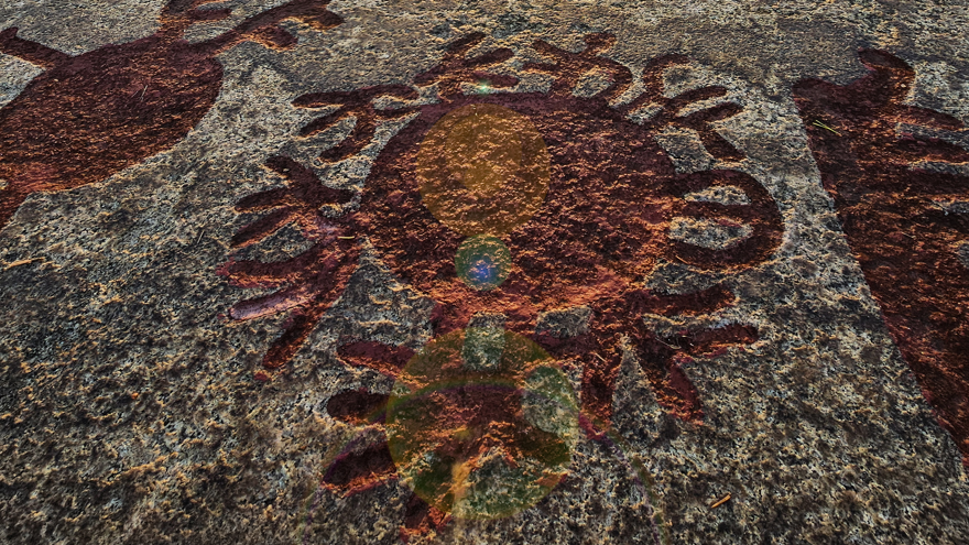rock carving sun symbol.